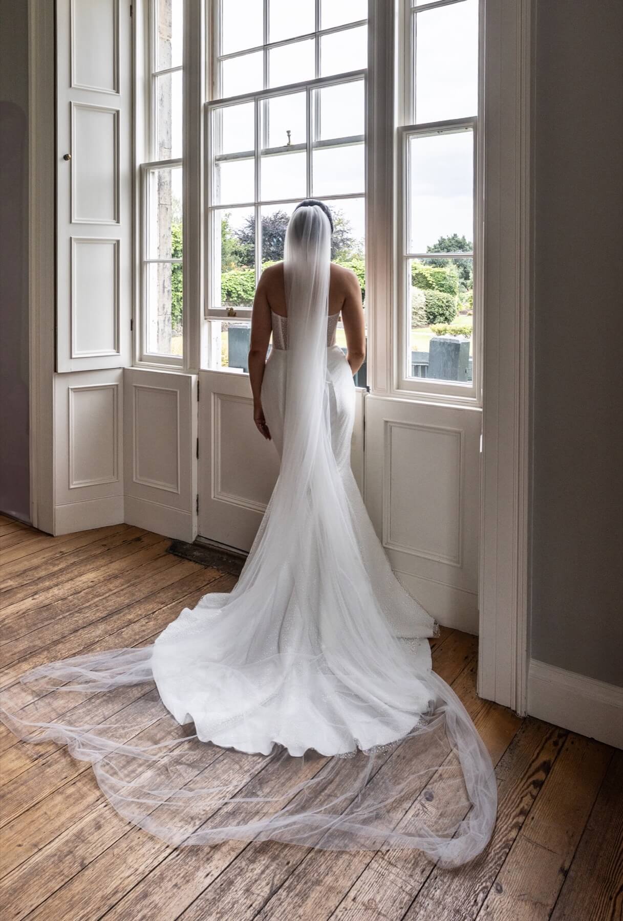 Bride at sash windows Old Rectory Killyman