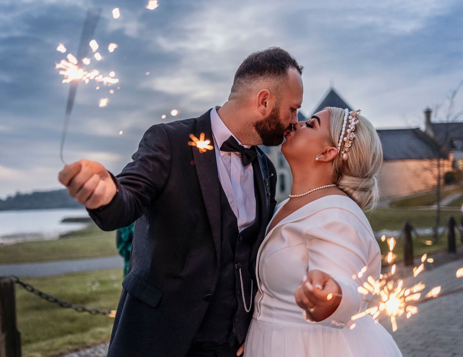 Wedding couple sparklers at dusk Lough Erne Resort Northern Ireland wedding photography