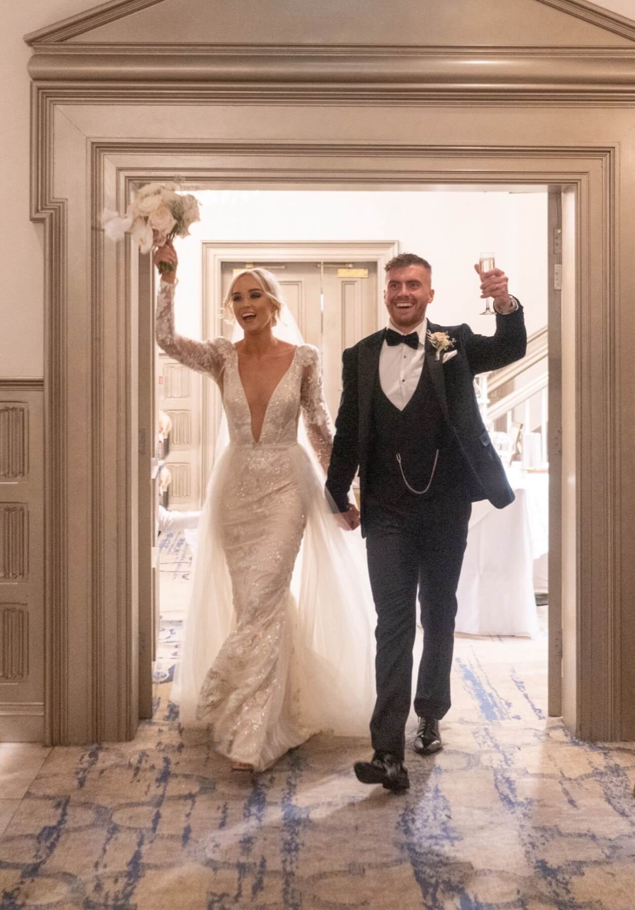 Wedding couple entering reception room Lough Erne Resort Northern Ireland wedding photography