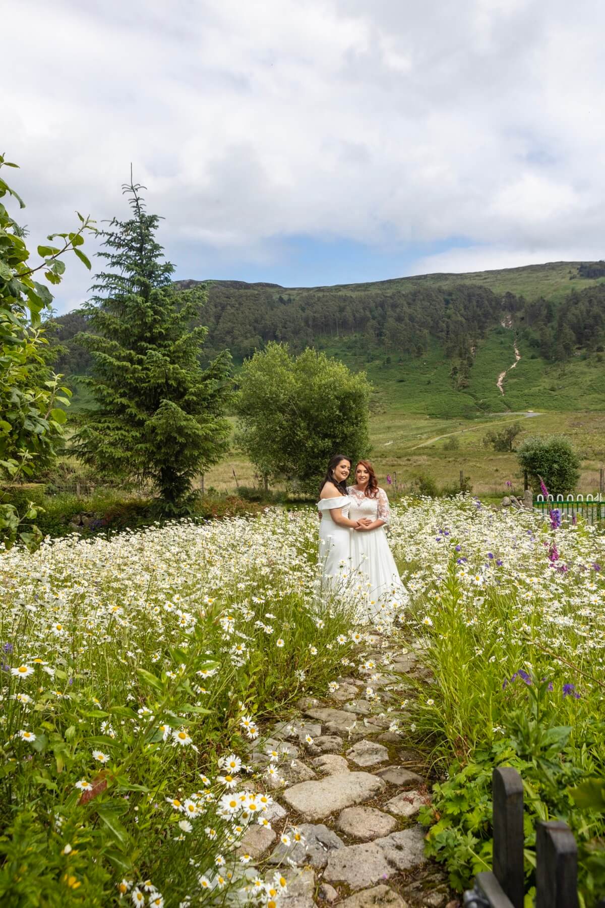 Wedding couple in wildflower meadow Rocky Mountain
