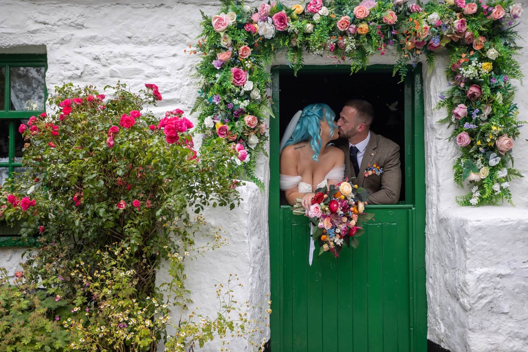 Wedding couple at whitewashed cottage Rocky Mountain